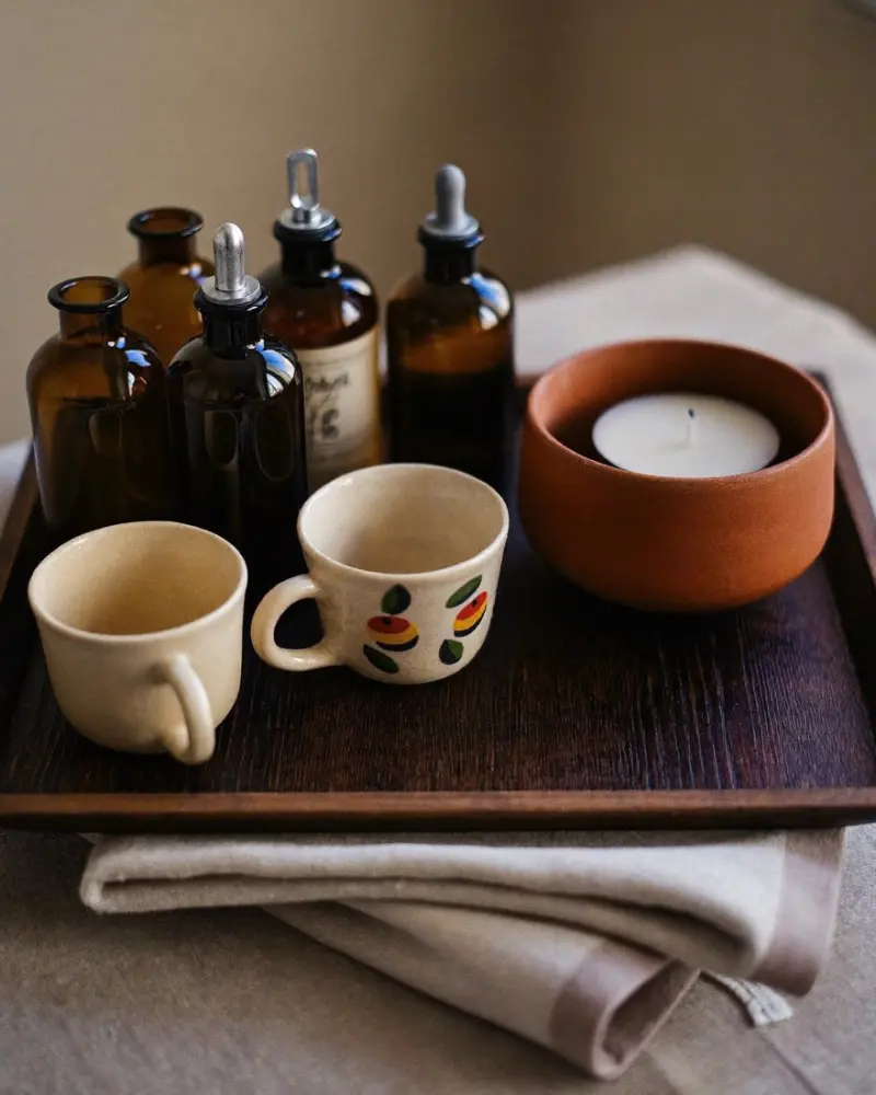 Ceramics and oils on a wooden tray